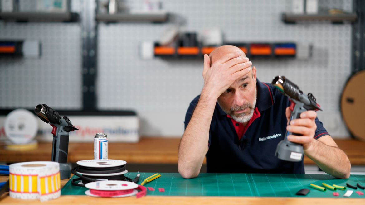 Man looking at CHG900 hot air tool