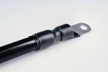 Semi-rigid halogen free polyolefin heat shrink tubing with an inner liner of hot melt adhesive.
